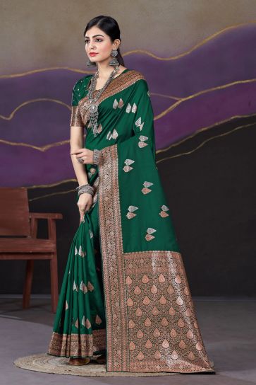 Weaving Work On Flamboyant Silk Fabric Saree In Dark Green Color