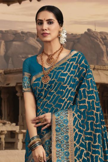 Dazzling Border Work On Teal Color Saree In Chiffon Fabric