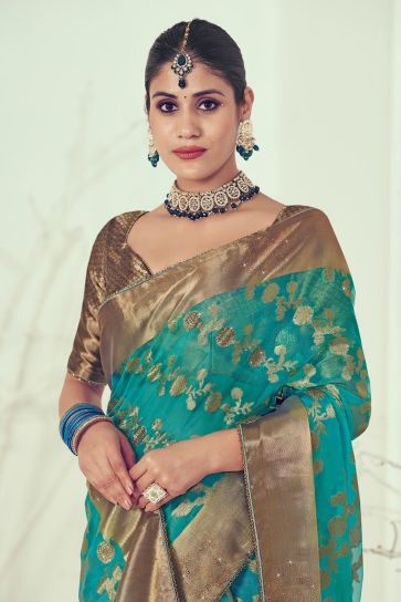 Appealing Weaving Work On Silk Fabric Saree In Teal Color