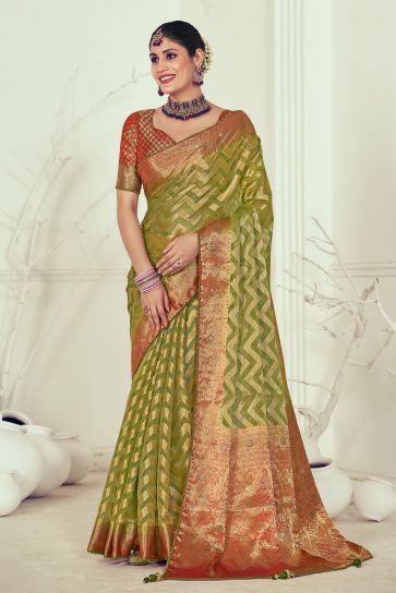 Organza Fabric Olive Color Coveted Weaving And Stone Work Saree