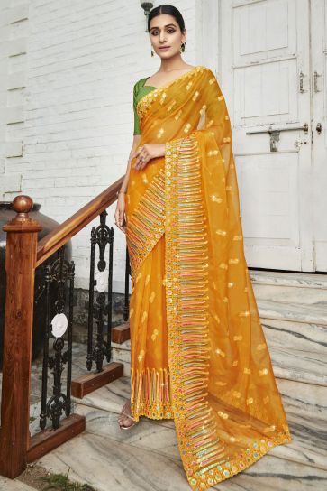 Mustard Color Embroidered And Stone Work Party Style Luminous Organza Saree