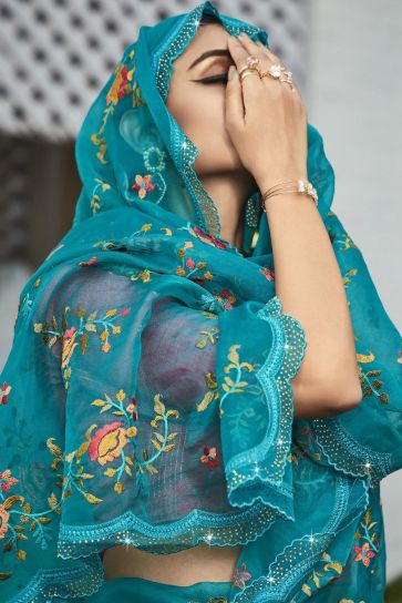 Embroidered And Stone Work Party Style Vivacious Organza Saree In Teal Color