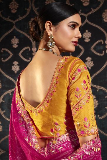 Charming Rani Color Organza Fabric Saree With Border Work