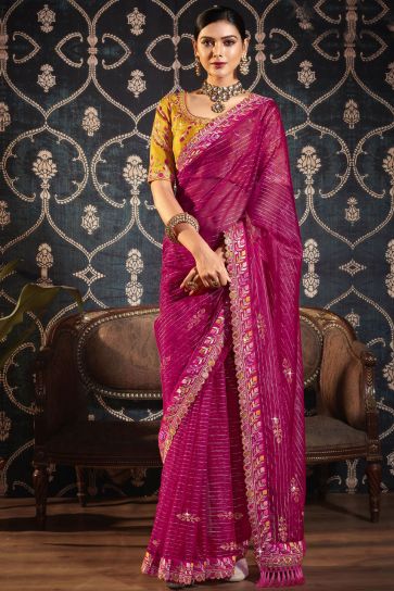 Charming Rani Color Organza Fabric Saree With Border Work