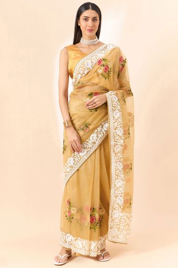 Trendy Organza Fabric Golden Color Saree With Embroidered Work