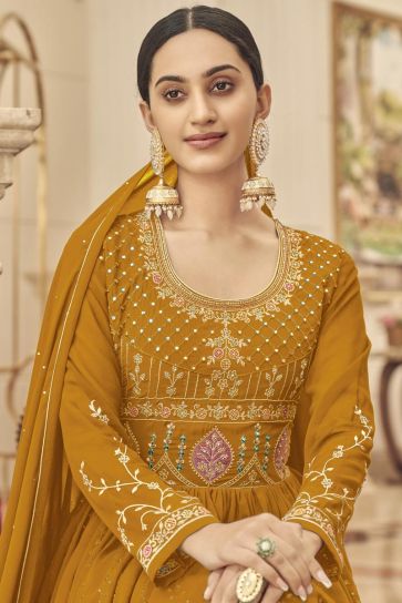Function Wear Georgette Fabric Enticing Anarkali Suit In Mustard Color