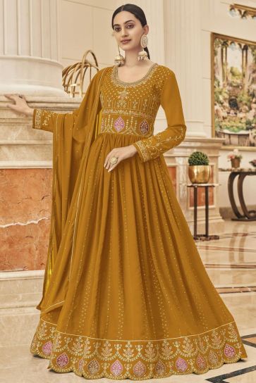 Function Wear Georgette Fabric Enticing Anarkali Suit In Mustard Color