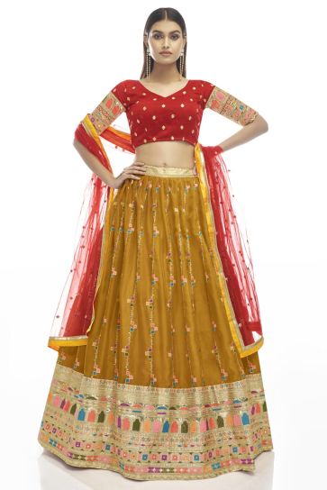 Vintage Embroidered Work On Georgette Fabric Lehenga In Mustard Color