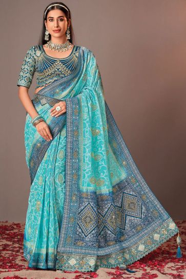 Cyan Color Exquisite Silk Saree With Heavy Embroidered Velvet Blouse