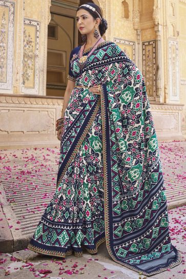 Soothing Printed Patola Silk Saree In Navy Blue Color
