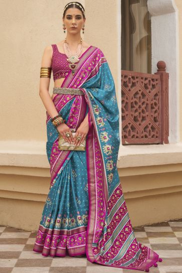 Delightful Cyan Printed Patola Silk Function Wear Saree