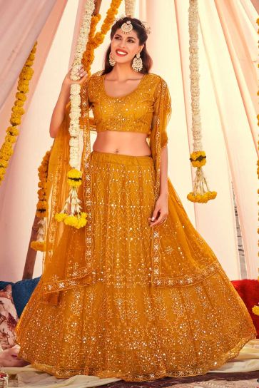Embroidered Designs On Net Fabric Superior Lehenga In Mustard Color