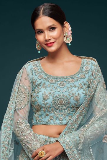 Engaging Cyan Color Net Fabric Lehenga With Embroidered Work