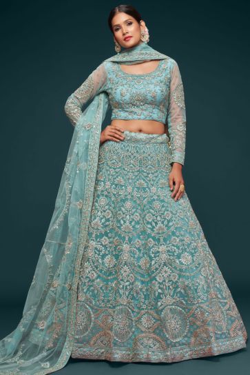 Engaging Cyan Color Net Fabric Lehenga With Embroidered Work