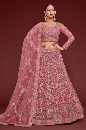 Embroidered Work On Glamorous Lehenga In Peach Color Net Fabric