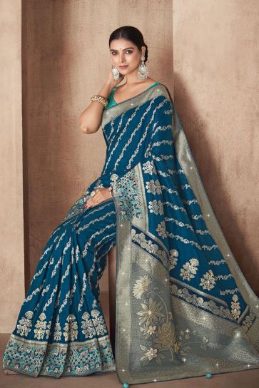 Exclusive Weaving Work Teal Color Silk Fabric Saree With Designer Blouse