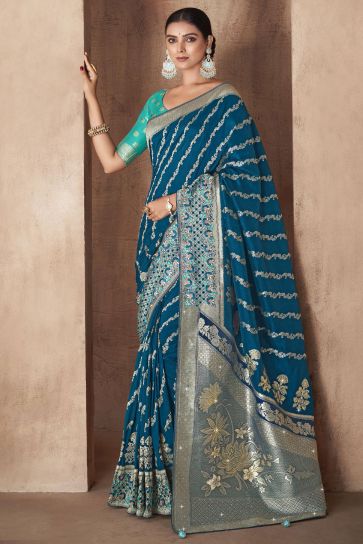 Exclusive Weaving Work Teal Color Silk Fabric Saree With Designer Blouse