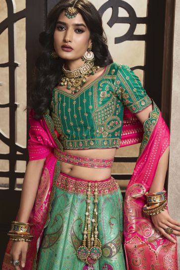 Silk Fabric Sea Green Color Bridal Lehenga With Winsome Sequins Work
