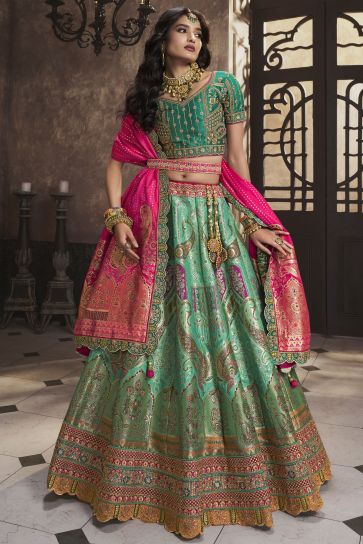 Silk Fabric Sea Green Color Bridal Lehenga With Winsome Sequins Work